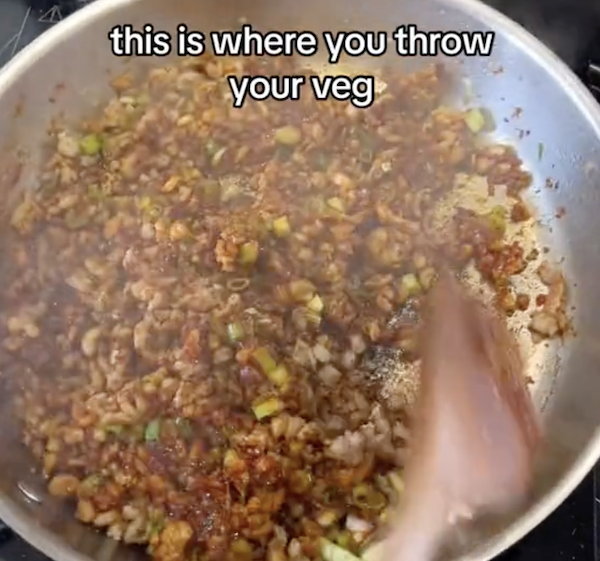 ground meat browning in a frying pan